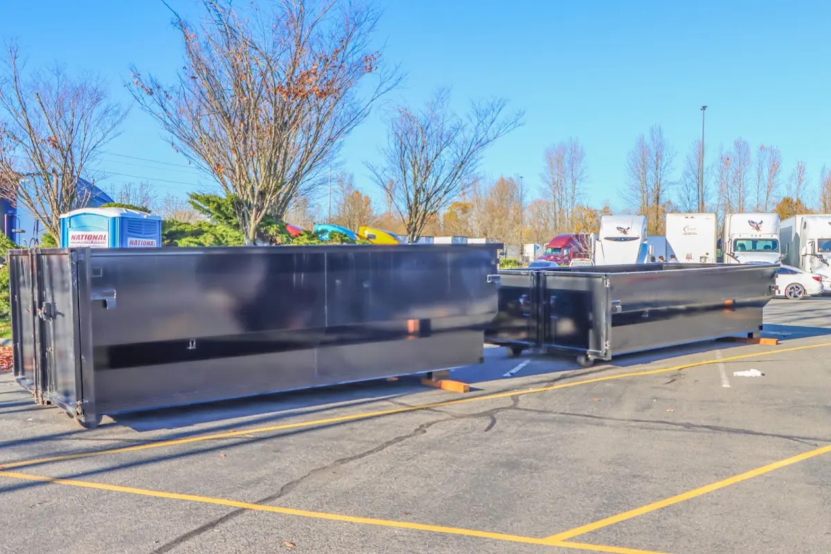 Professional dumpster rental service with roll-off container on residential driveway in Citrus Park